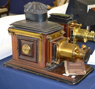 Lot 1223 - A Good Quality 19th Century Mahogany and Brass Magic Lantern, with tinplate hood and corrugated...