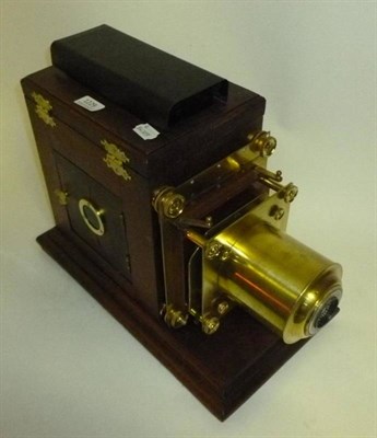 Lot 1229 - A Mahogany and Brass Magic Lantern by Carl Zeiss, Jena, with Tessar f4.5/135mm lens, hinged...