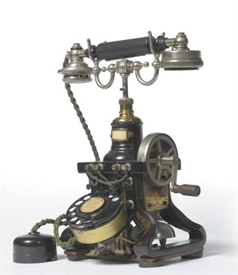 Lot 1007 - An Ericsson Eiffel Tower Telephone, the black enamelled cast iron body with gilt decoration,...