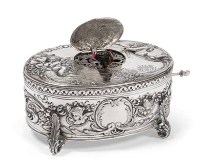 Lot 385 - A Continental Silver Singing Bird Musical Automaton, the case stamped 925, the oval case chased...