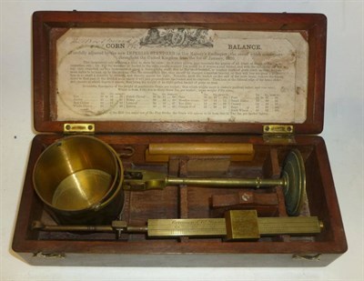 Lot 1048 - A 19th Century Mahogany Cased Brass Chondrometer or Corn Balance by Corcoran & Co., London, the...