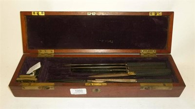 Lot 1050 - A 19th Century Mahogany Cased Surgeons Field Set, containing five ebony handled knives, scalpel and