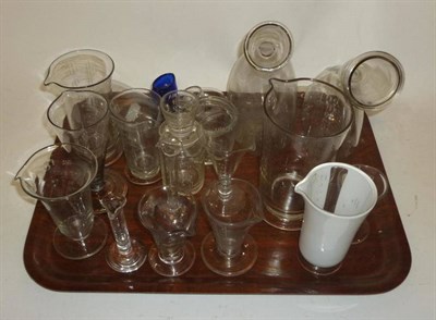 Lot 1056 - A Collection of 18th and 19th Century Medical Glassware and Chemists Measures, including a...