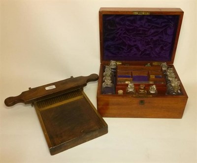 Lot 1058 - A 19th Century Mahogany Apothecary's Box, containing fourteen clear glass bottles with stoppers...