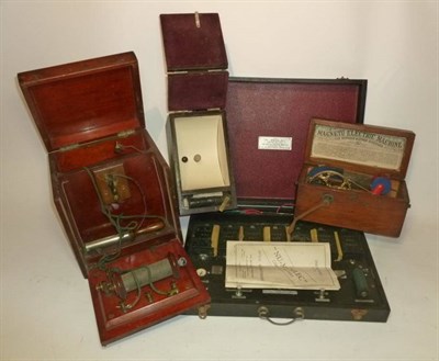 Lot 1064 - Four Boxed Instruments - two mahogany cased electric shock machines, a cased 'Nu-Medelec'...