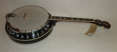 Lot 1101 - A Gold Tone Short Scale 4-String Tenor Banjo, with mahogany neck, flame maple resonator,...