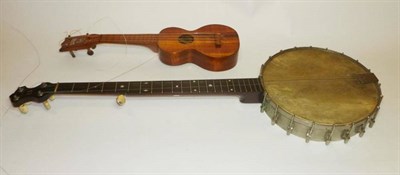 Lot 1105 - A Five String Zither Banjo, with open back, 28cm head with chrome tension brackets, mahogany...