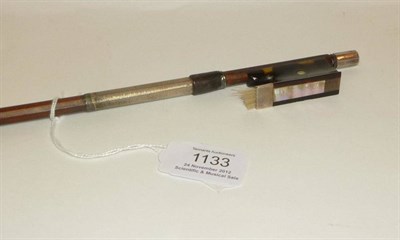 Lot 1133 - An Early 20th Century German Silver Mounted Violin Bow by Heinrich Heberlein, the tortoiseshell...