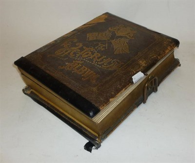 Lot 1169 - A 19th Century Musical Disc Playing Photograph Album - The Victorian Album, with small musical disc