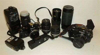 Lot 1195 - Nikon Cameras and Accessories, including a black Nikon FA camera No.5304601 with Nikkor...