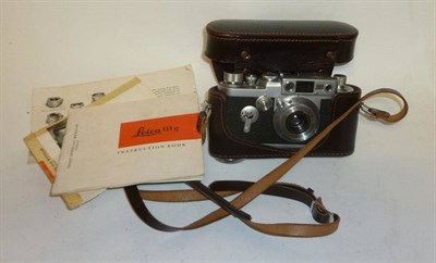 Lot 1201 - A Leica IIIg Camera No.981734, circa 1959, in chrome, with collapsible screw mount Elmar...