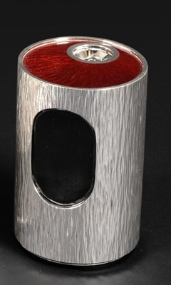 Lot 402 - A Modern Silver Table Lighter, Gerald Benney, London 1973, the textured cylindrical body with a red