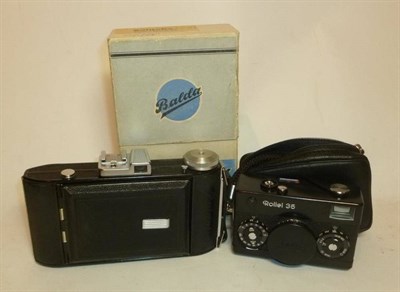 Lot 1206 - Two Cameras:- Rollei 35 No.6155704, in black, with Tessar f3.5/40mm lens, in leather case, with...