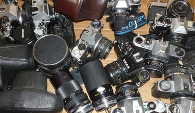 Lot 1215 - Eleven 35mm Cameras with Lenses, including Olympus OM-10 & OM-20, Canon AE-1, Pentax ME Super,...