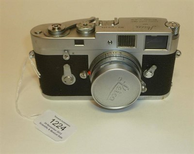 Lot 1224 - A Leica M2 Chrome Camera No.976074, circa 1959, with self timer, collapsible chrome f2.8/50mm...