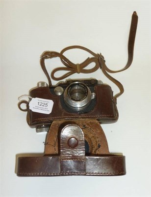 Lot 1225 - A Leica III Black Camera No.115451, circa 1934, with collapsible chrome screw mount Summar...