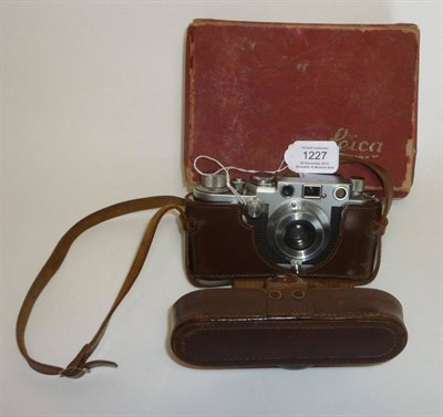 Lot 1227 - A Leica IIIf Chrome Camera No.8140621, circa 1956, with red dial and self timer, collapsible chrome