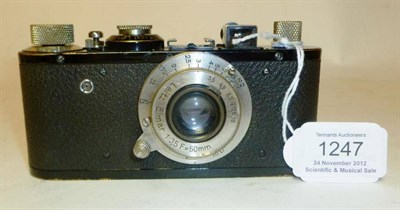 Lot 1247 - A Leica Standard Camera No.101209, circa 1932, with black enamel finish, collapsible Elmar...