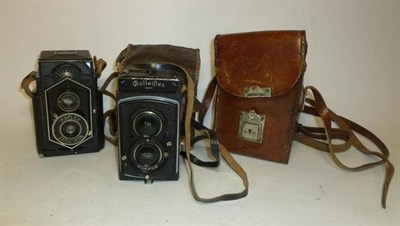 Lot 1266 - Two Twin Lens Reflex Cameras:- Rolleiflex No.283889, in black, with Tessar f3.8/75mm lens,...