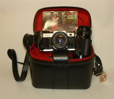 Lot 1276 - Optical Equipment, including a Canon AE-I camera outfit with three lenses, in leather bag,...