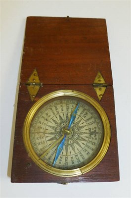 Lot 1012 - A Mahogany Cased Pocket Compass, with paper dial, blued steel pointer, brass fittings and...
