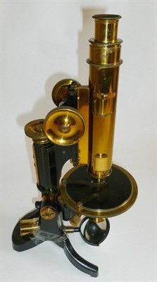 Lot 1028 - A Lacquered Brass and Black Enamelled Polarising Microscope by J.Swift & Son, London, with rack...