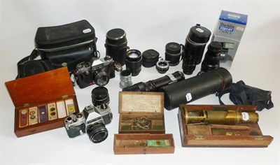 Lot 1032 - Scientific Instruments and Cameras, including a 19th century lacquered brass drum microscope...