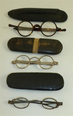 Lot 1054 - A Pair of George III Silver Framed Spectacles, hallmarks for London 1812, with circular lenses...