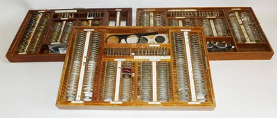 Lot 1056 - Collection of Opticians Test Lenses, with frames, in five mahogany and oak trays