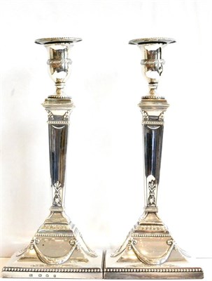 Lot 422 - A Pair of George III Silver Candlesticks, maker's mark RI, Sheffield 1778, in the Neo Classical...