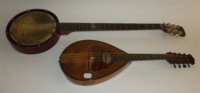 Lot 1137 - A 5-String Zither Banjo, with 19cm velum head, wooden resonator, bone tuning pegs, in leather case