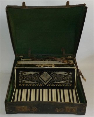 Lot 1147 - An Italian 'Geraldo Standard' Piano Accordion, with faux mother of pearl and black and white...