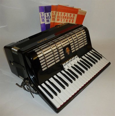 Lot 1150 - A Galotta 'Ideal' Piano Accordion, in black with white keyboard, with music, cased