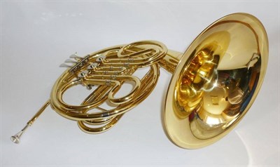 Lot 1156 - A Lacquered Brass French Horn by Gear 4 Music, with three nickel plated keys, in a hard plastic...