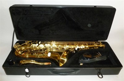 Lot 1158 - A Brass Tenor Saxophone by Stagg, model number 77-ST, with faux mother of pearl inset keys, in...