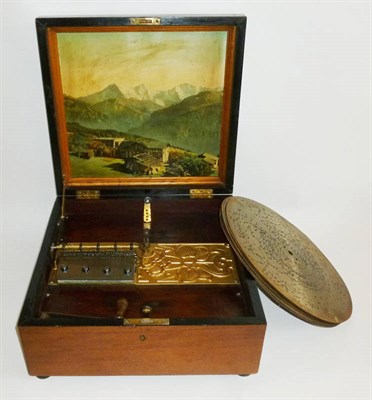 Lot 1174 - A Walnut Cased 'Kalliope' Table Top Musical Disc Player, with gilt metal Art Nouveau baseplate,...