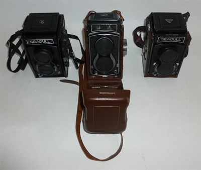 Lot 1197 - Three Seagull Twin Lens Reflex Cameras, various models, all in leather cases