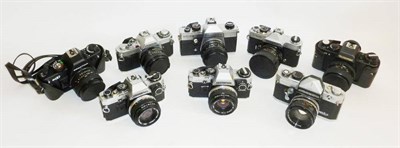 Lot 1200 - A Collection of 35mm Cameras, including a Rolleiflex SL35E, Olympus OM-10, Canon AV-1,...