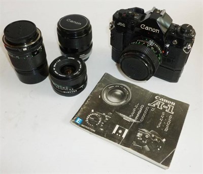 Lot 1213 - A Canon A1 Camera, in black, serial number 1906484, with f1.4/50mm lens, manual and power...