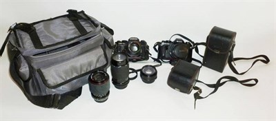 Lot 1215 - Cameras and Accessories, including a Chinon CE-4s, Ricoh KR-10x, Sigma and Tokina lenses etc., in a