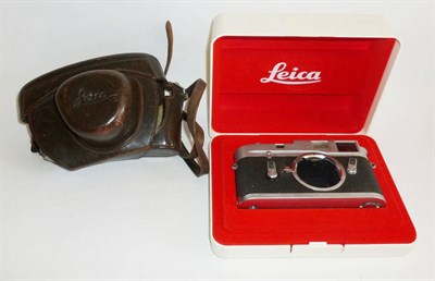 Lot 1223 - A Leica M4 Chrome Camera Body No.1194708, with stitched leather case and original plastic box