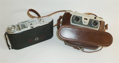 Lot 1236 - A Wray Stereo Graphic Camera, in a stitched leather case; A Voightlander Bessa I Folding...