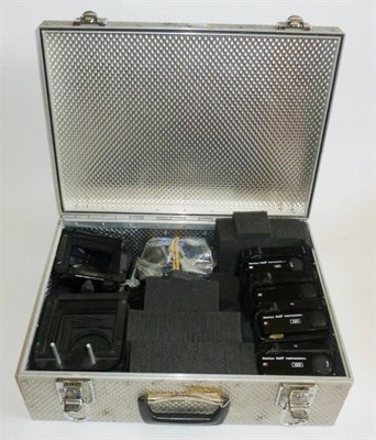 Lot 1253 - Four Mamiya RZ67 Professional II Camera Backs, with other accessories, in a metal case