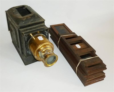 Lot 1261 - A Tinplate and Brass Magic Lantern, together with ten large coloured strip slides in mahogany...