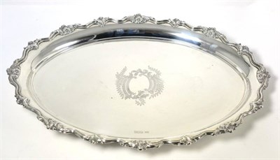 Lot 455 - An Oval Silver Tray, Walker & Hall, Sheffield 1953, oval, with a cast and applied border, the...