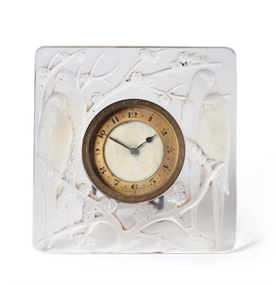 Lot 482 - A René Lalique Inseparables Clear and Opalescent Glass Dressing Table Clock, moulded with two...