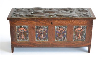 Lot 491 - An Arts & Crafts Oak and Copper Casket, in the form of a blanket chest, the rectangular copper...