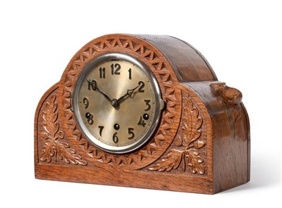 Lot 512 - A Robert  "Mouseman " Thompson Oak Mantel Clock, the arched top case with triangular repeating...