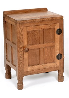 Lot 519 - A Robert  "Mouseman " Thompson Panelled Oak Bedside Cupboard, with raised upstand, above a...