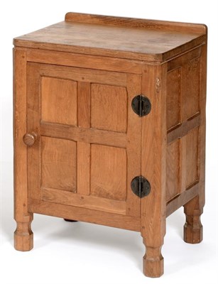 Lot 520 - A Robert  "Mouseman " Thompson Panelled Oak Bedside Cupboard, with raised upstand, above a...